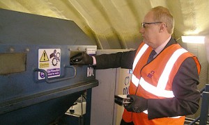 Minister Damian Green puts ID card hard drive into shredder