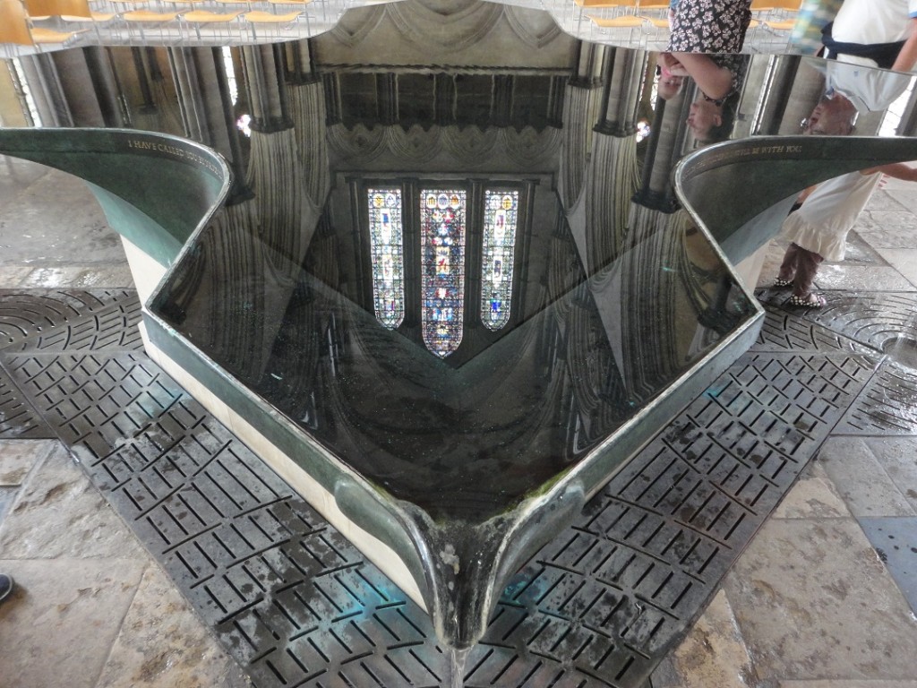Reflected glory: stained glass windows and the roof reflected in Salisbury Cathedral’s font