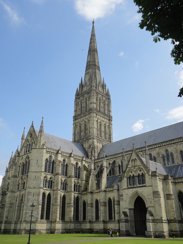 Stonehenge upgraded, with roof, spire, stained glass windows and infinity font