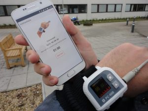 Oxford hand device and smartphone, worn by Dario Silva